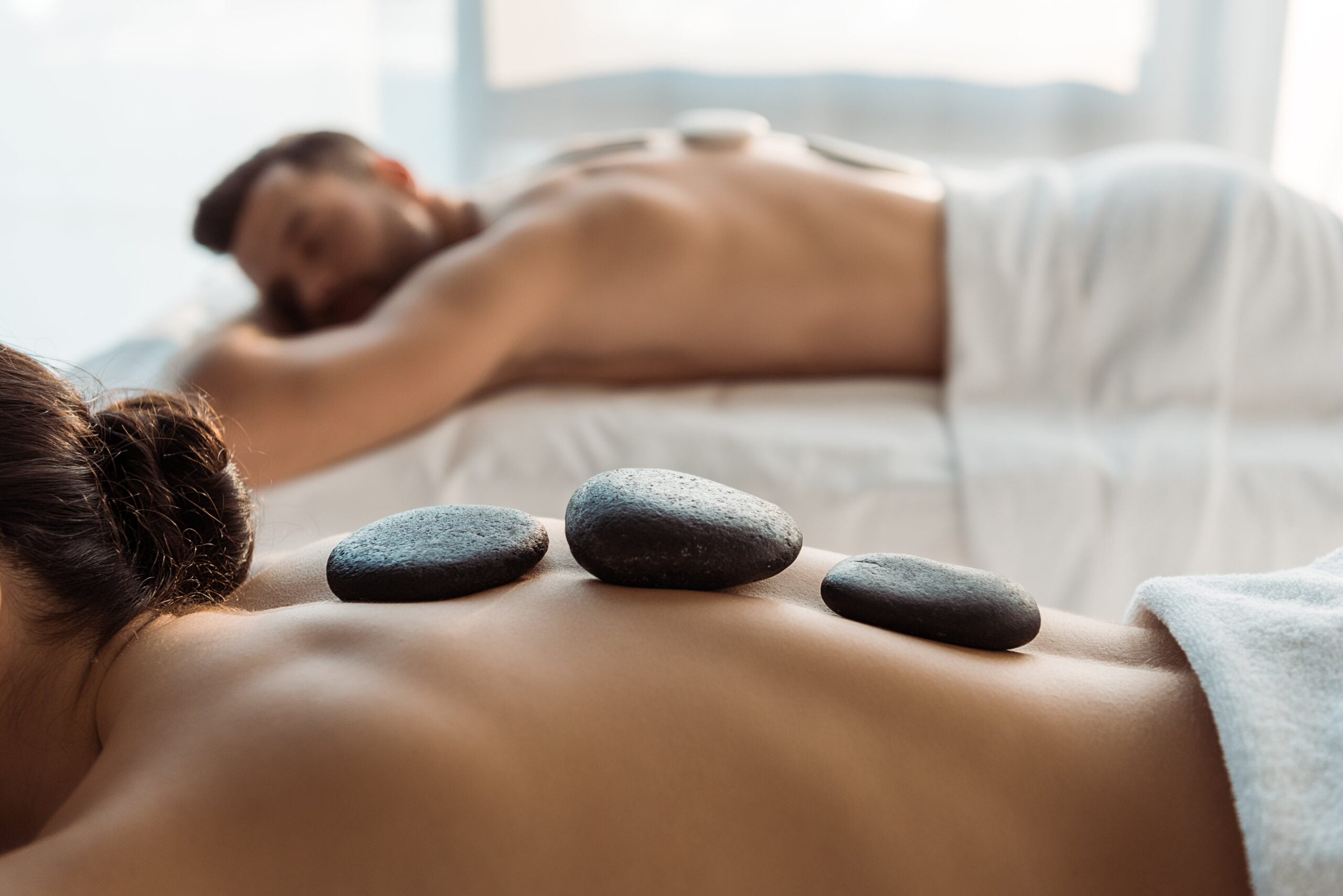 Couple getting a Hot Stone Massage at Neroli Salon & Spa