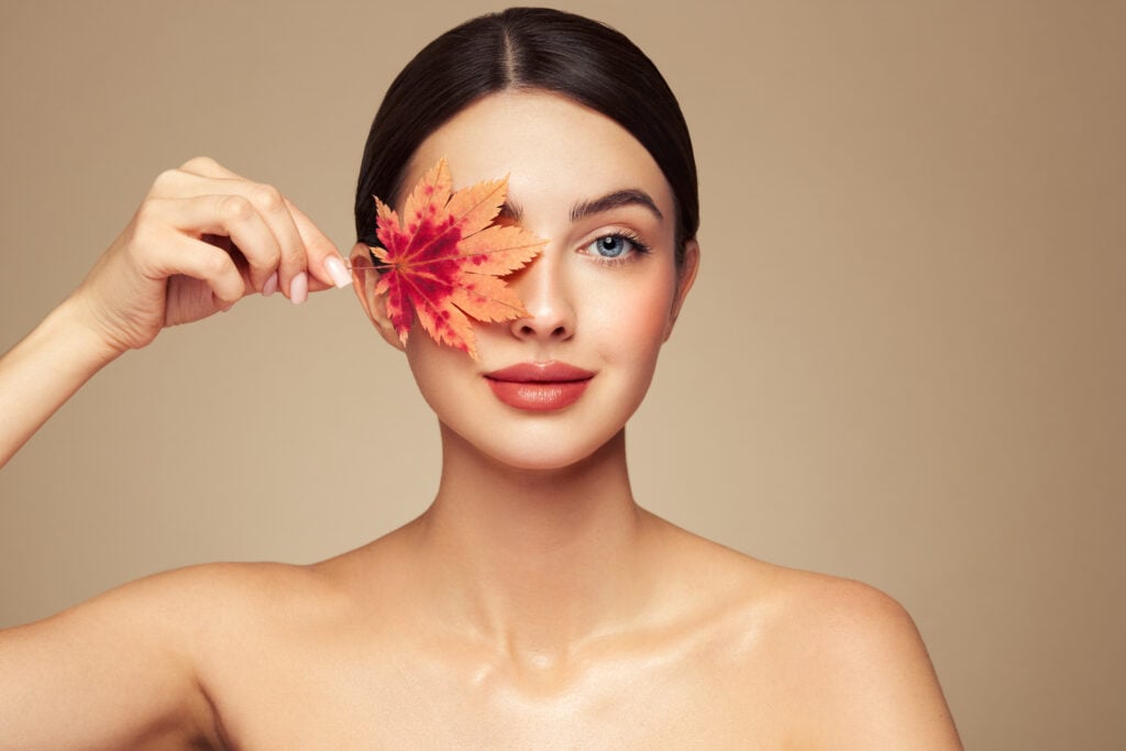 Woman with glowing skin representing a fall skincare routine using Ultraceuticals products